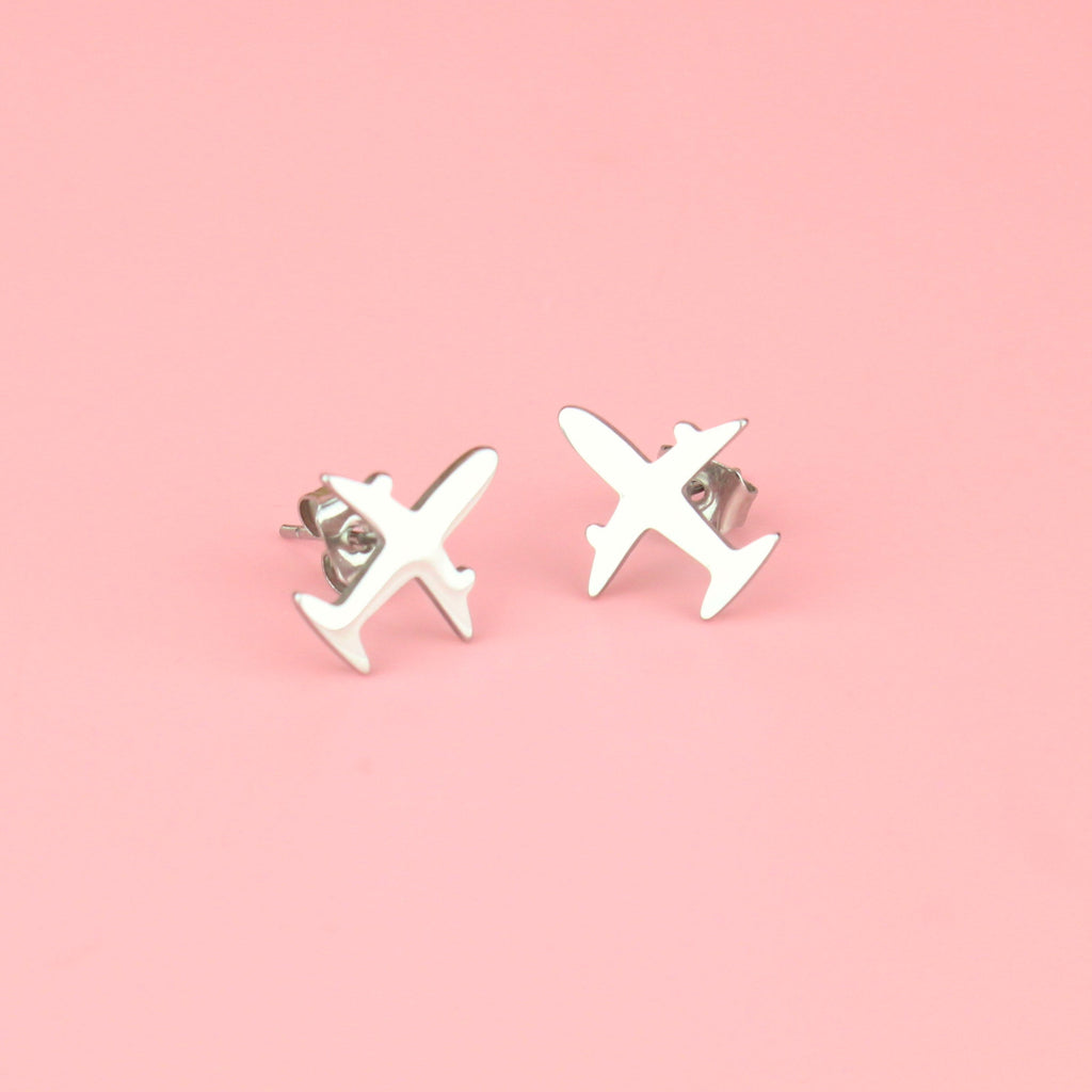 two aeroplane shaped studs 