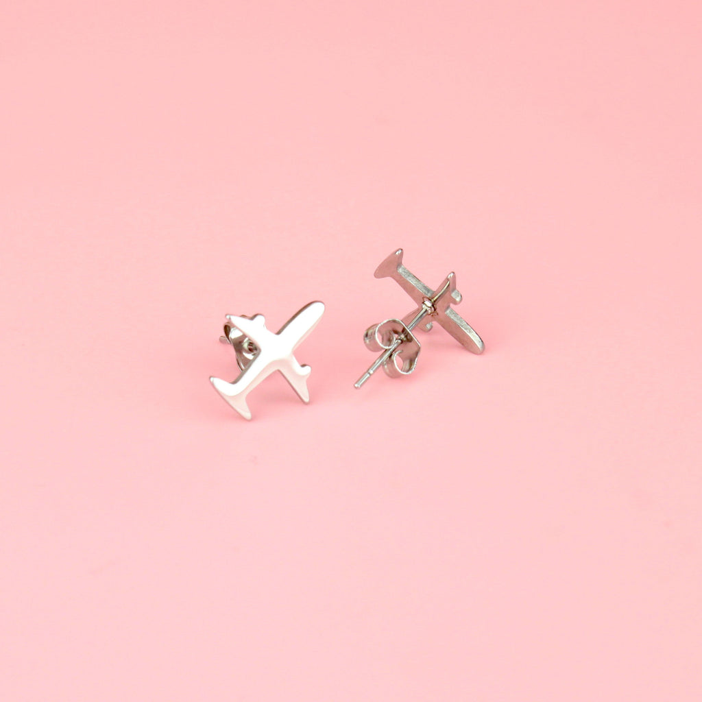 two aeroplane shaped studs