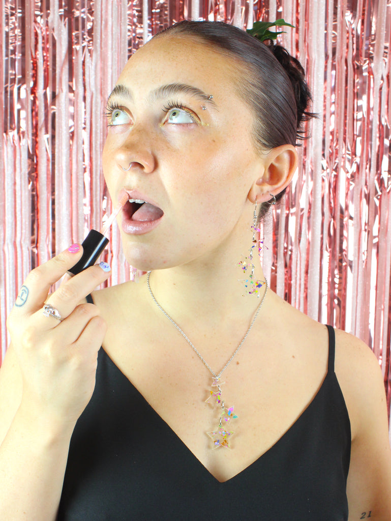 Model wearing confetti star charms on a stainless steel chain