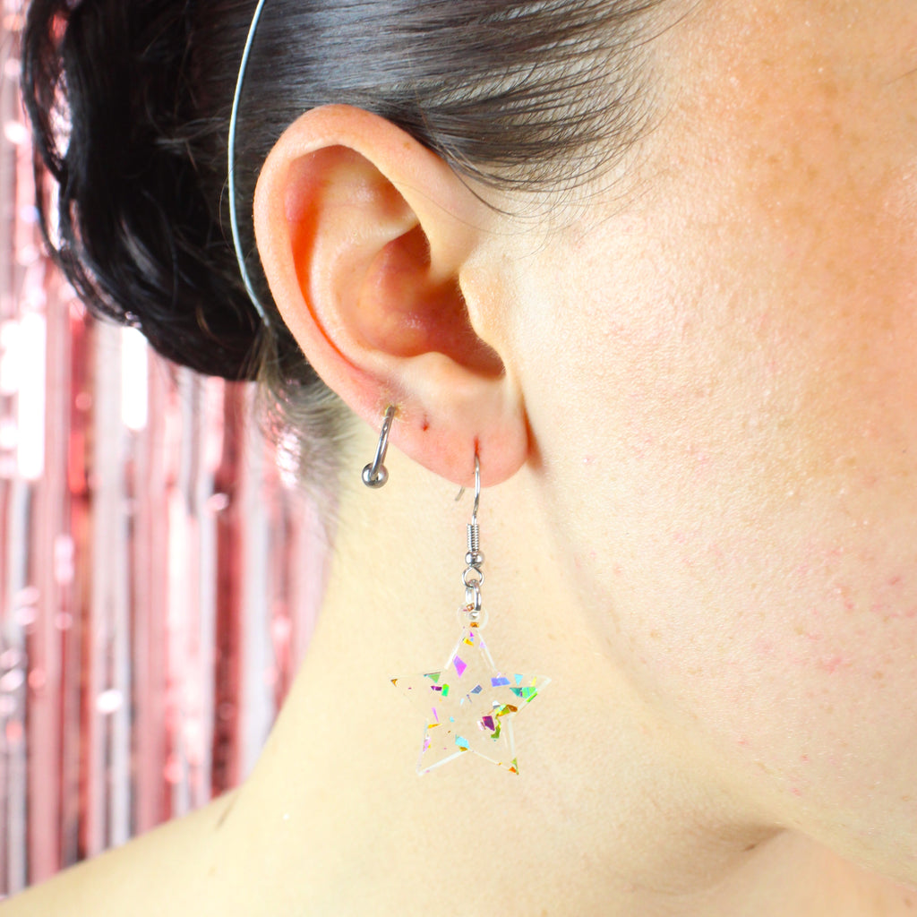 Model wearing confetti star earrings on stainless steel earwires