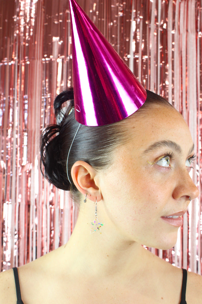 Model wearing confetti star earrings on stainless steel earwires