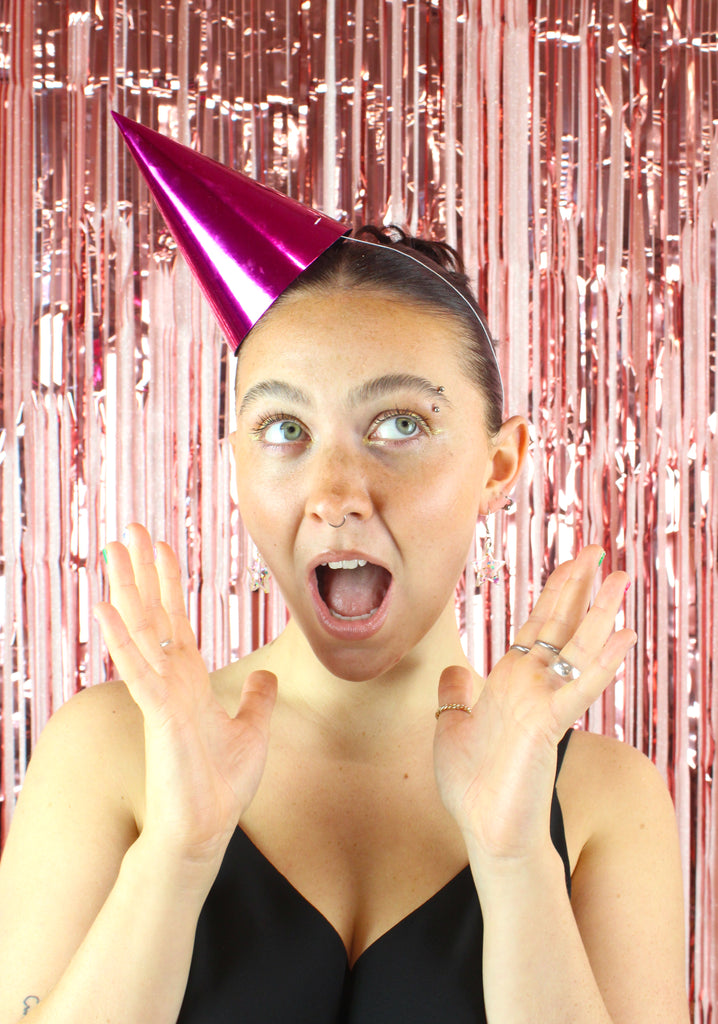 Model wearing confetti star earrings on stainless steel earwires