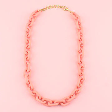 Acrylic coral coloured chunky oval link necklace with gold plated stainless steel fittings