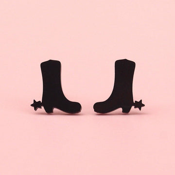 Black cowboy boot shaped studs with aa star next to the heel made from stainless steel