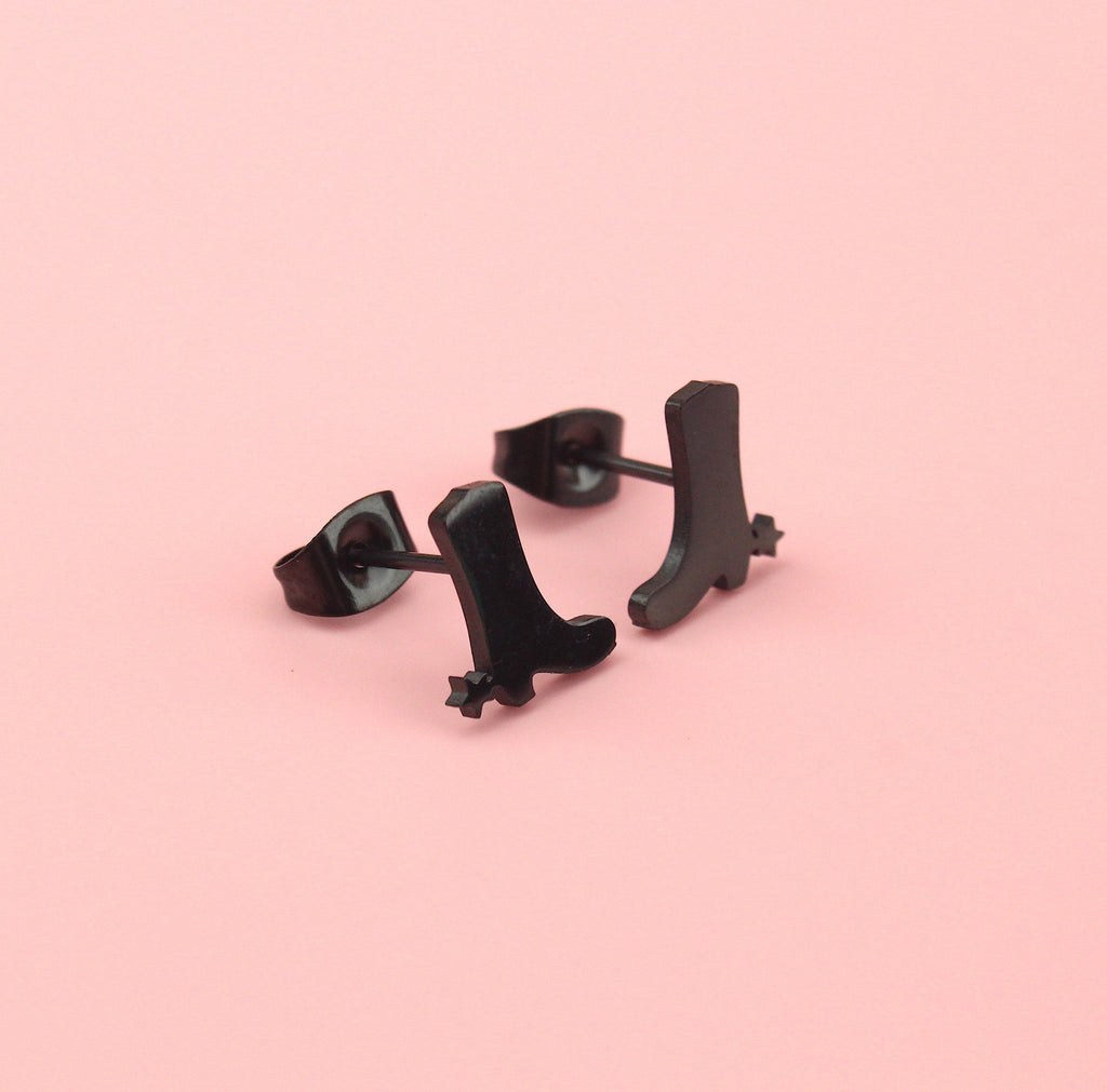 Black cowboy boot shaped studs with aa star next to the heel made from stainless steel with backs