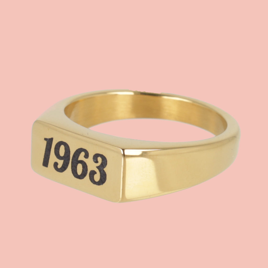 gold plated titanium with birth year engraved in black