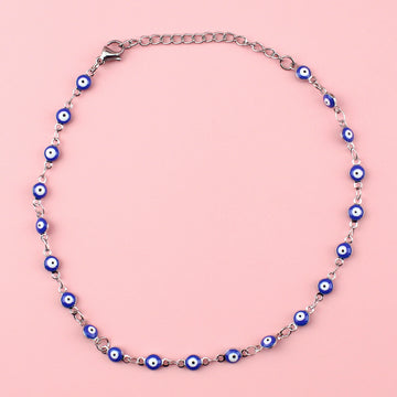Dark blue evil eye charms on a stainless steel anklet