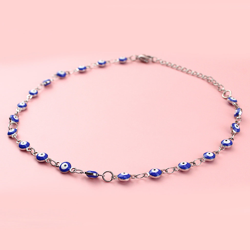 Dark blue evil eye charms on a stainless steel anklet