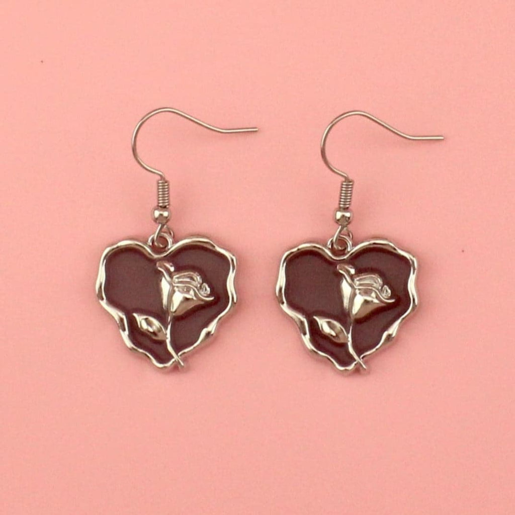 Brown heart earrings with a silver outline and silver rose in the middle on stainless steel earwires