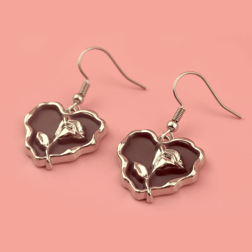 Brown heart earrings with a silver outline and silver rose in the middle on stainless steel earwires