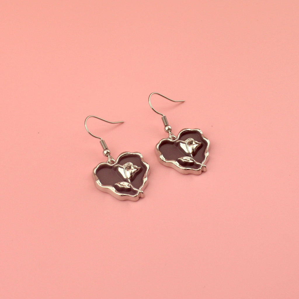 Brown heart earrings with a silver outline and silver rose in the middle on stainless steel earwires