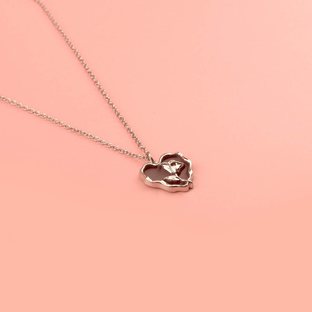 Dark brown heart pendant with silver outline and silver rose in the middle on a stainless steel chain