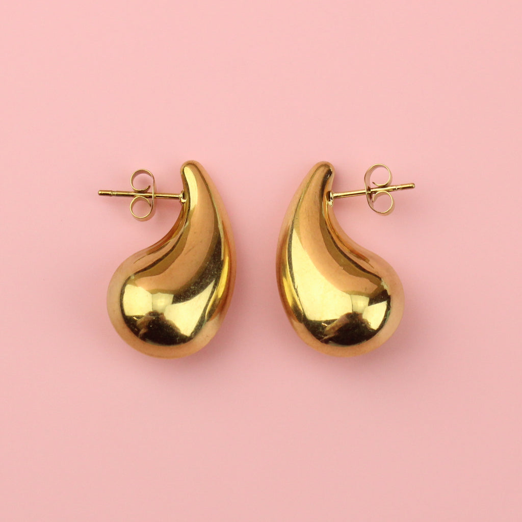 Gold plated stainless steel earrings in the shape of a droplet