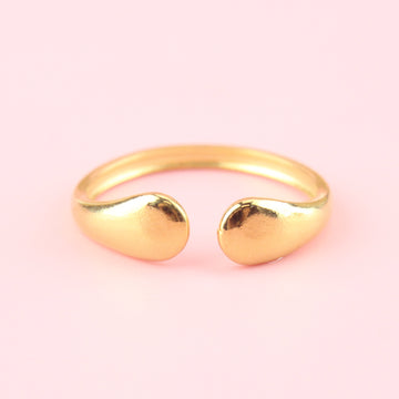 Gold plated stainless steel ring in the shape of two droplets 