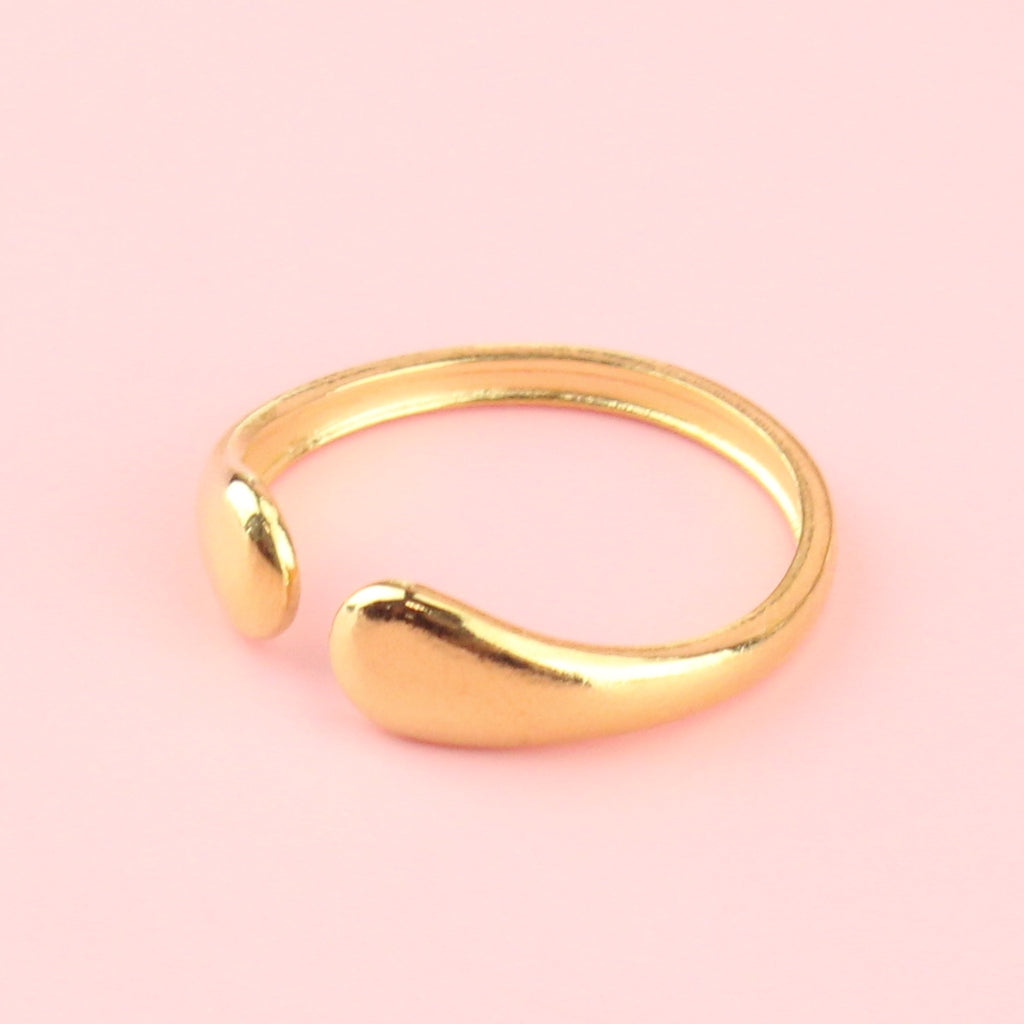 Gold plated stainless steel ring in the shape of two droplets