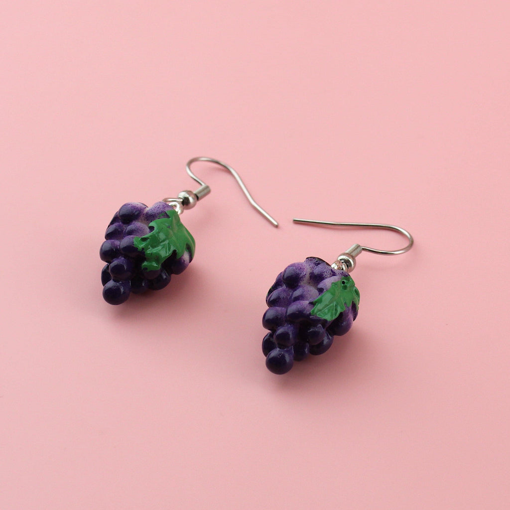 A bunch of grapes on stainless steel earwires