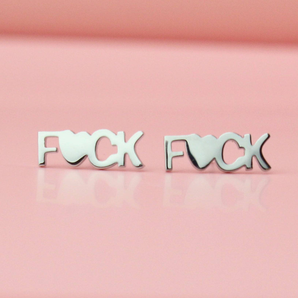 Studs with the word F*ck on with the U being replaced with a heart