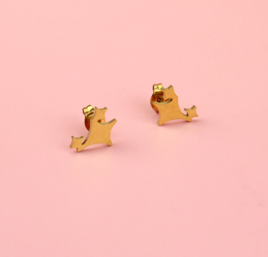 Three gold glimmer shaped stars on gold plated stainless steel studs