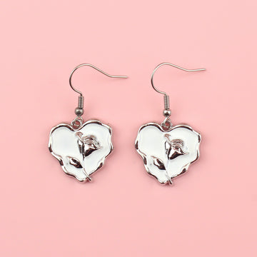 White heart charms with a silver outline and a silver rose in the middle on stainless steel earwires