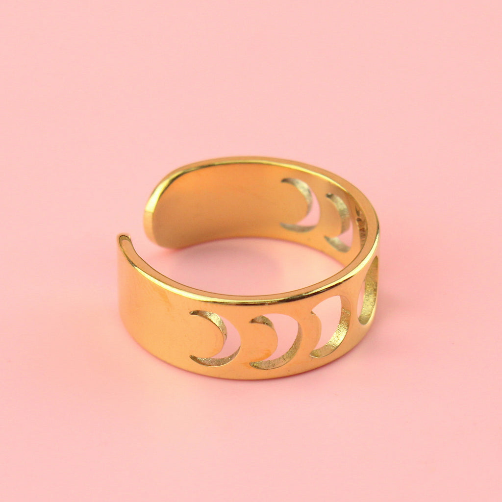 gold plated stainless steel ring with a cut out moon phase design