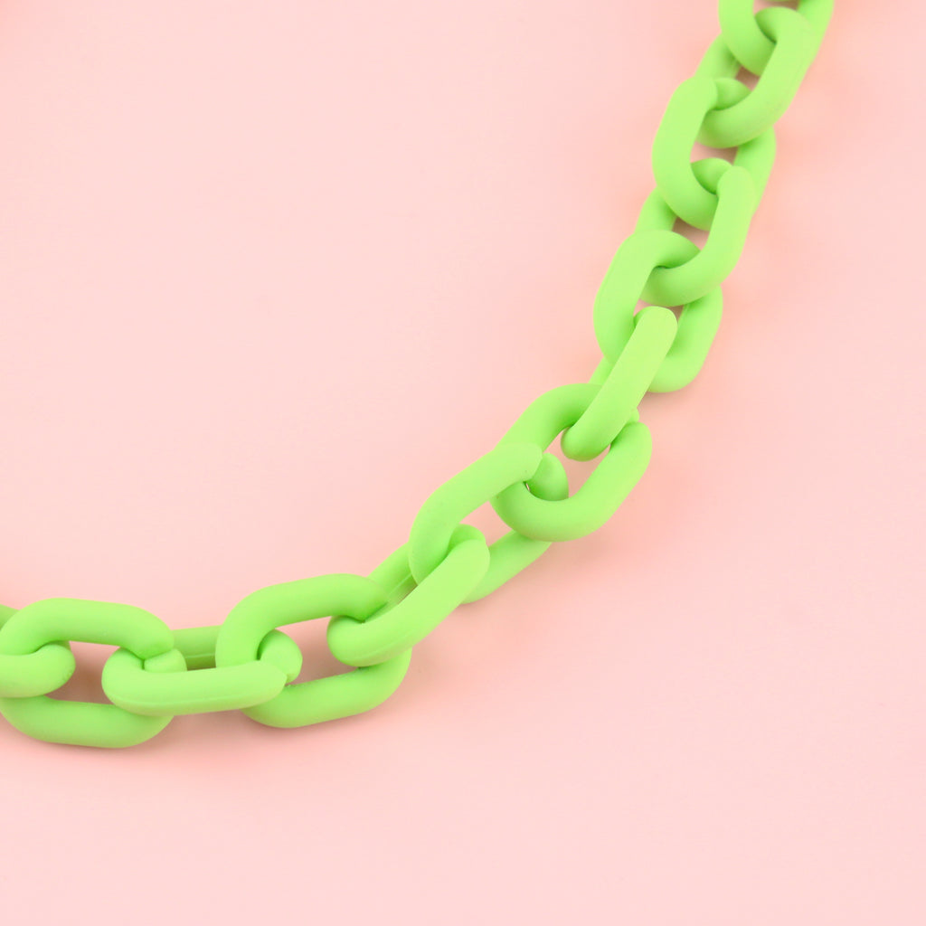 Close up of green acrylic chunky oval link necklace 