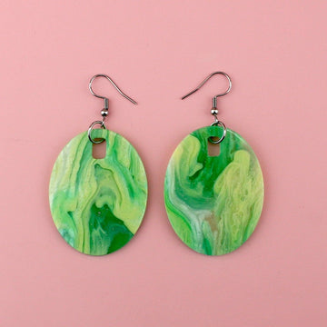 Oval shaped green sparkling glittery marble resin charms on stainless steel earwires