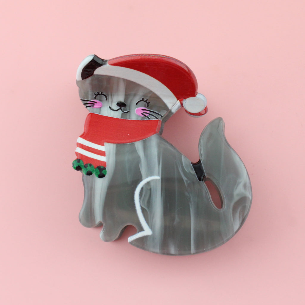 Grey Cat with a santa hat and a red scarf