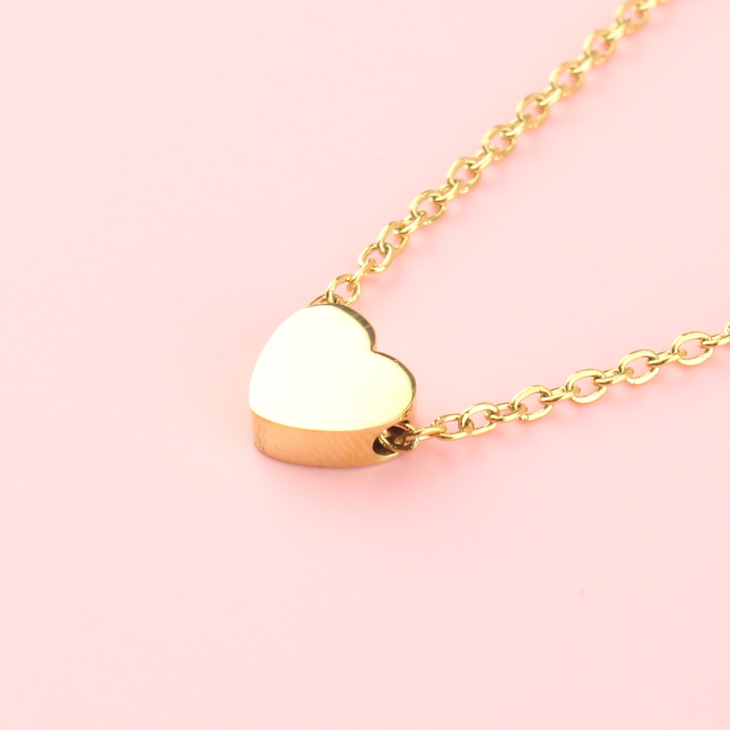 Solid gold heart pendant on a gold plated stainless steel chain