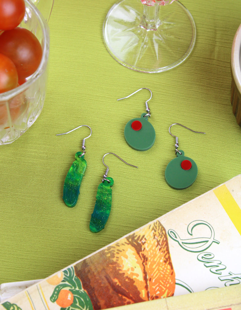Acrylic olive charms on stainless steel earwires pictured with the dill-lightful earrings