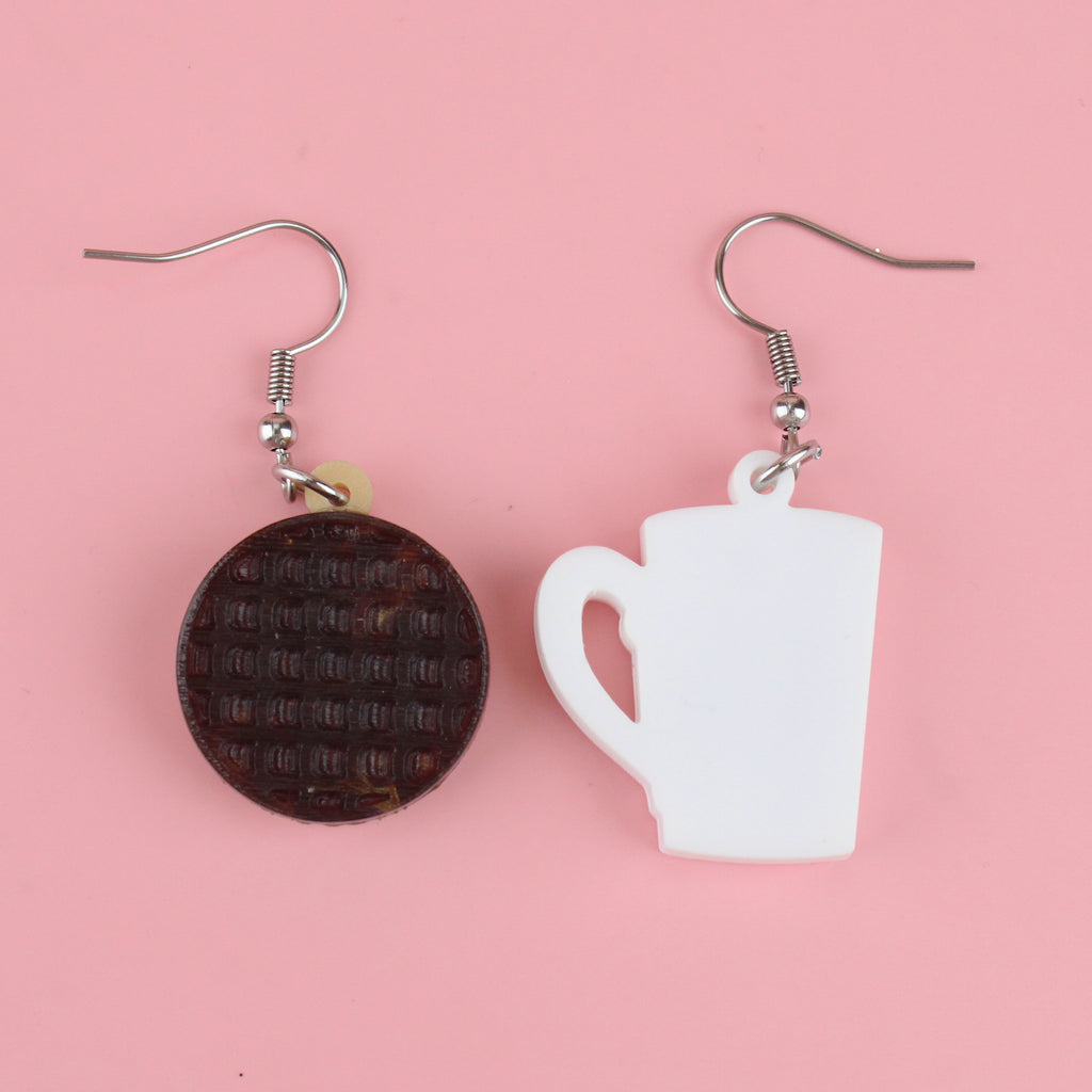 showing the 'chocolate' side of the digestive charm and the back of the cup of tea charm