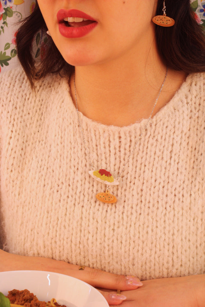 Model wearing Spaghetti bolognese and garlic bread pendants on a stainless steel chain