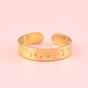 Gold plated stainless steel ring with moons and stars engraved on the band