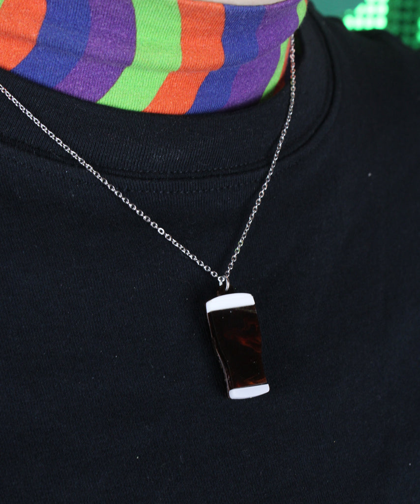 Model wearing stout pendant on a stainless steel chain
