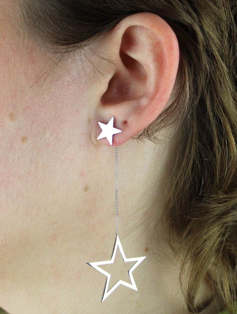 Cut out stars suspended from a dangly chain and star studs