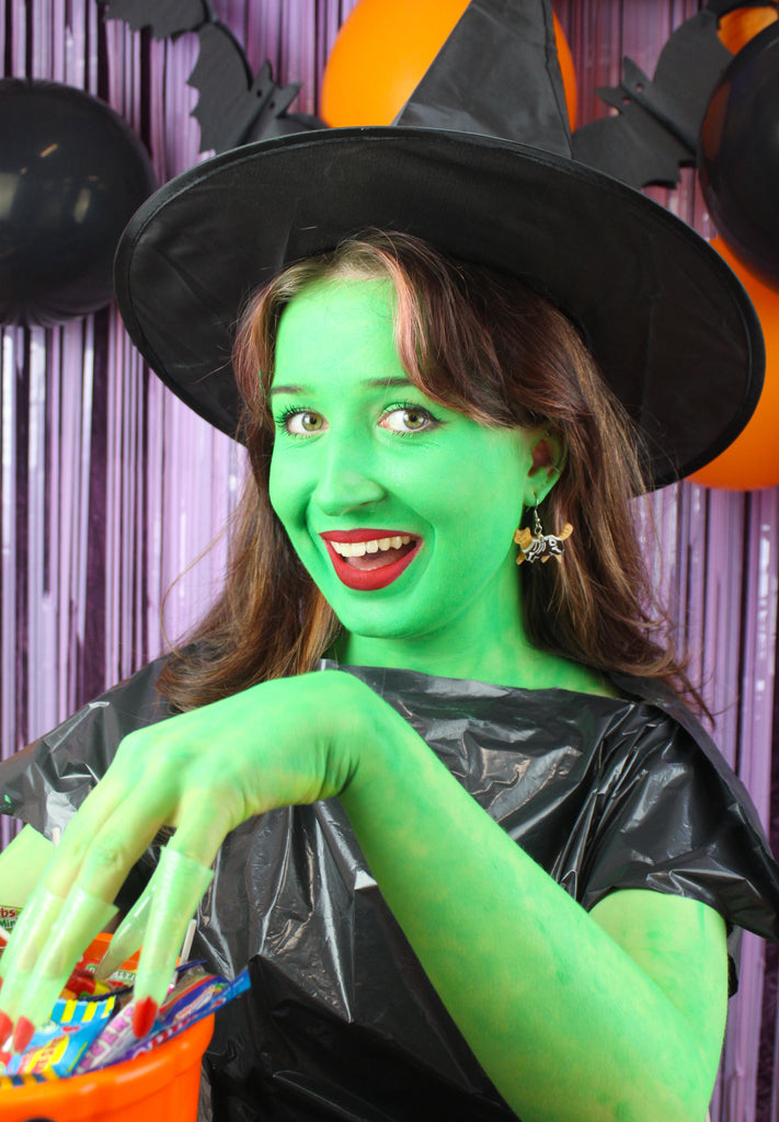 model wearing ginger cat skeleton charms on stainless steel earwires 