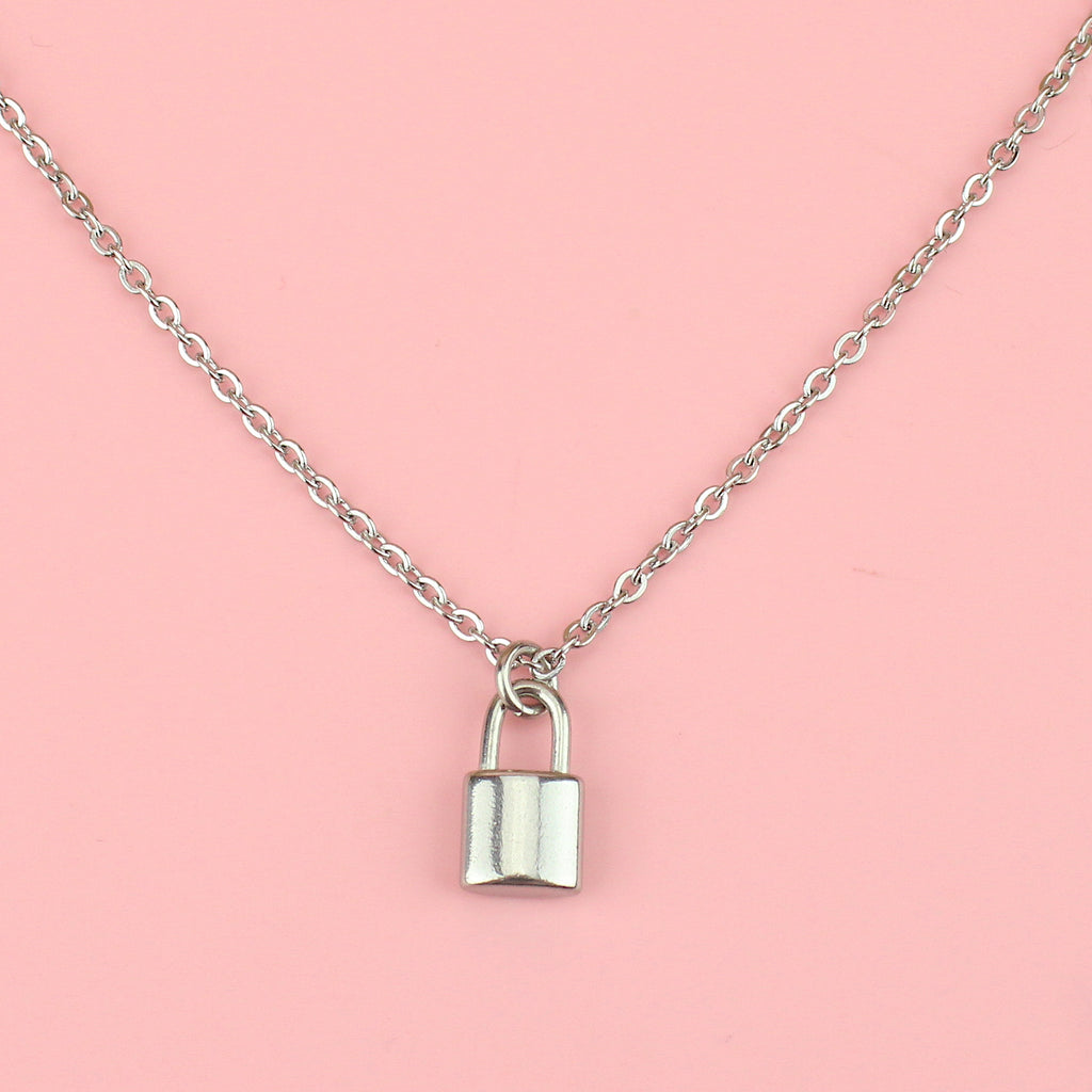 a stainless steel chain featuring a delicate padlock charm