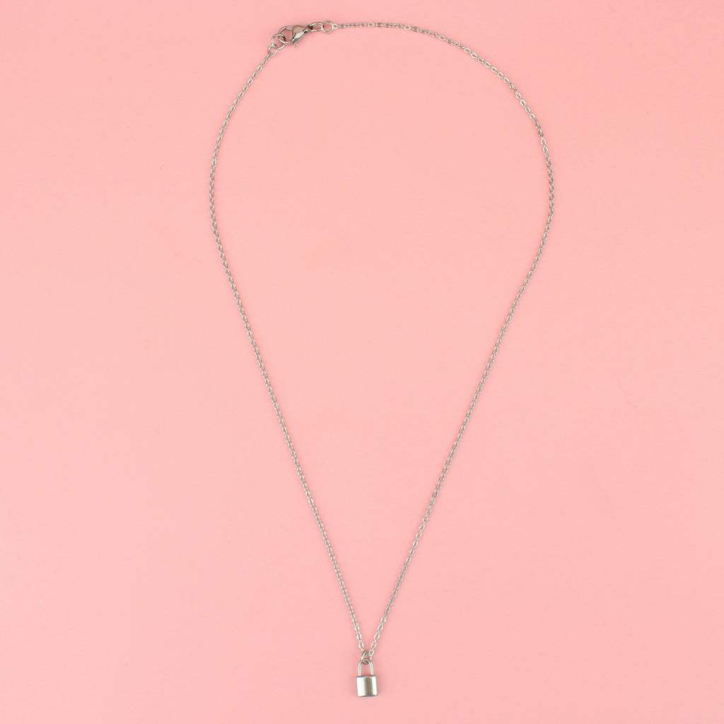a stainless steel chain featuring a delicate padlock charm