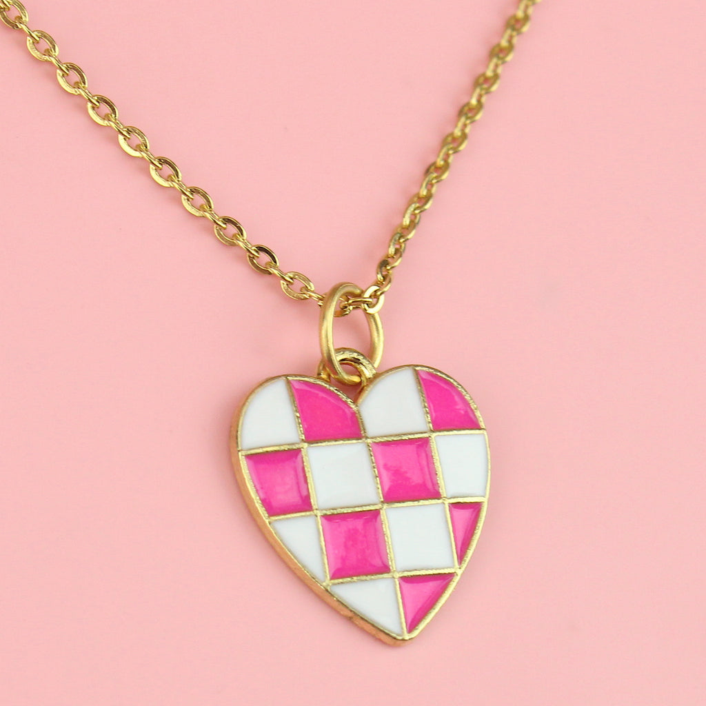 Gold plated base metal pink and white checkerboard heart-shaped pendant on a gold plated stainless steel chain