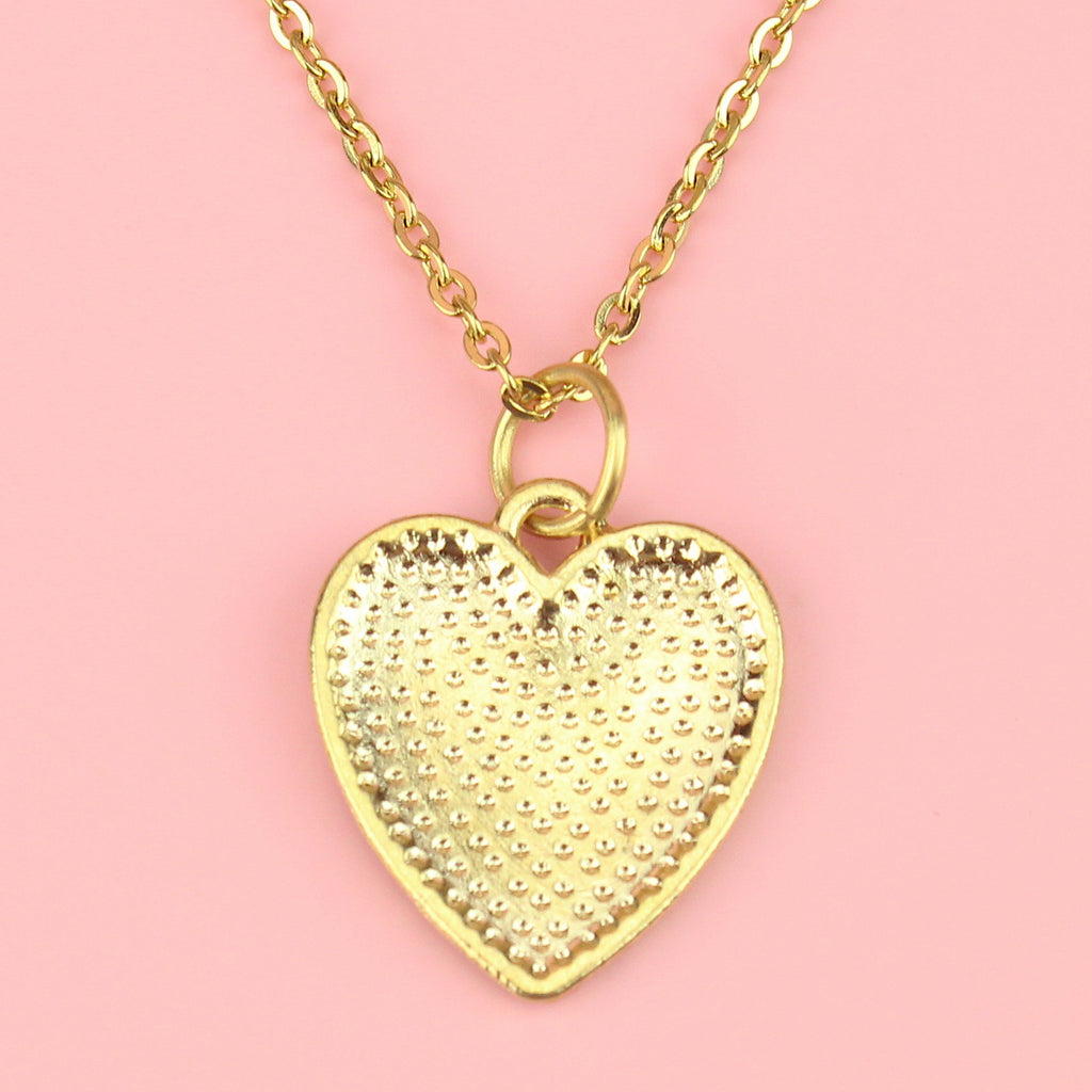 back of Gold plated base metal pink and white checkerboard heart-shaped pendant on a gold plated stainless steel chain