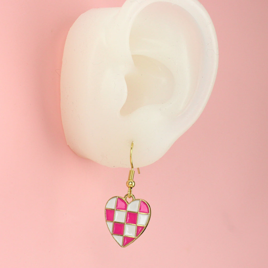 EAR WEARING WHITE AND PINK CHECKERBOARD HEARTS BADE FROM GOLD PLATED BASE METAL ON GOLD PLATED STAINLESS STEEL EARWIRES