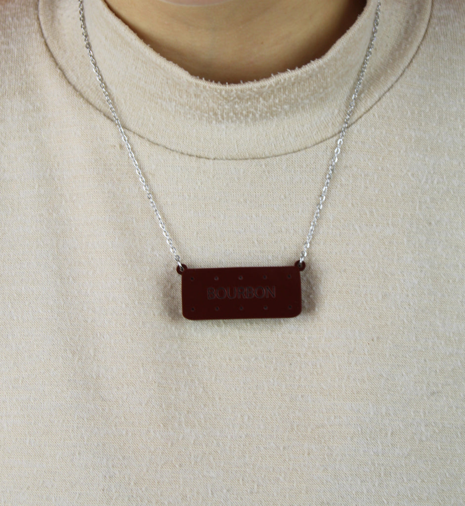 Necklace with a bourbon biscuit pendant worn by model