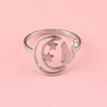 stainless steel ring with a crescent moon on the left with 2 stars and a cat facing the moon on the right