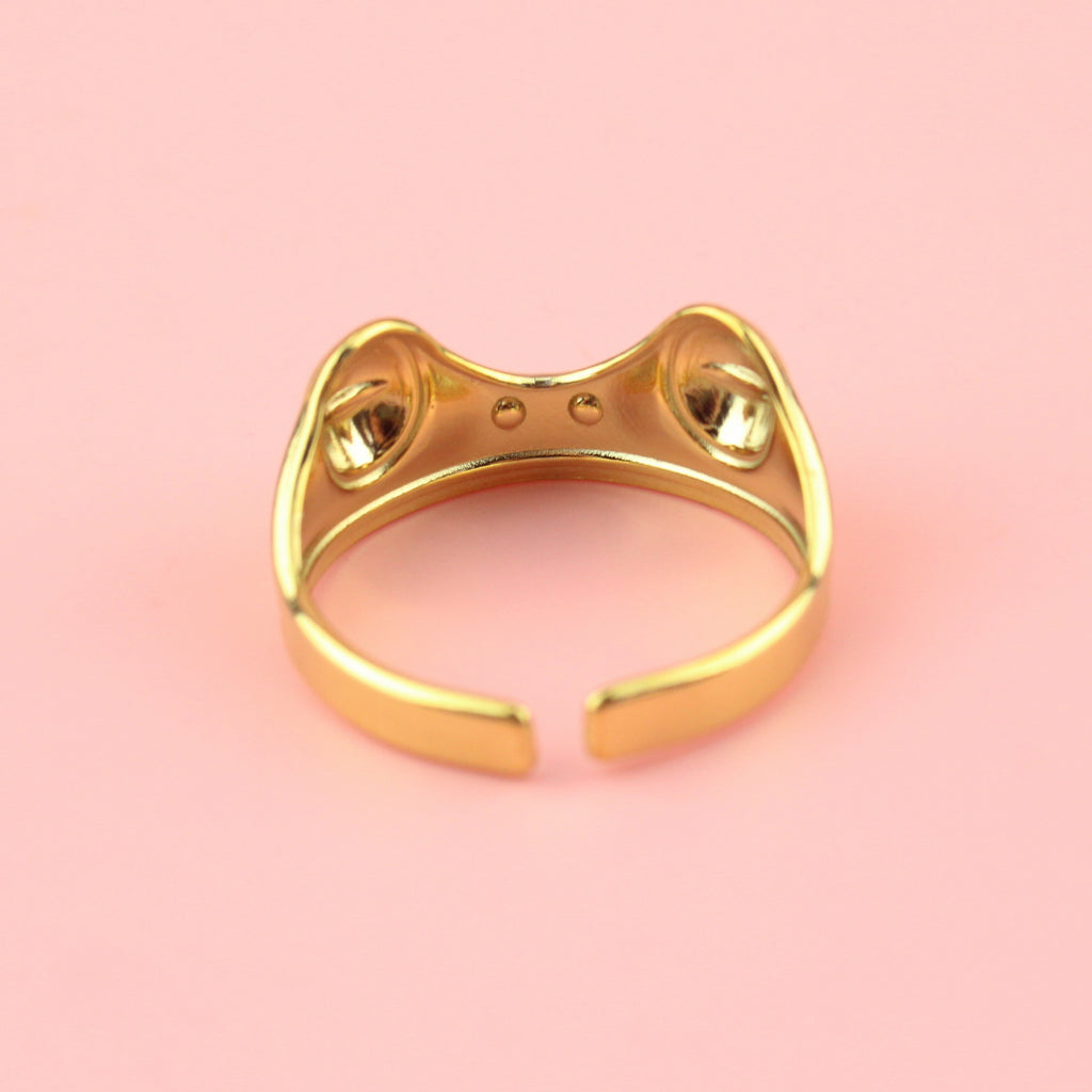 Gold plated stainless steel ring featuring two frog eyes and nostrils on the front of the ring