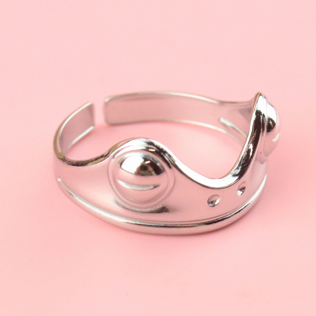 stainless steel ring featuring two frog eyes and nostrils on the front of the ring