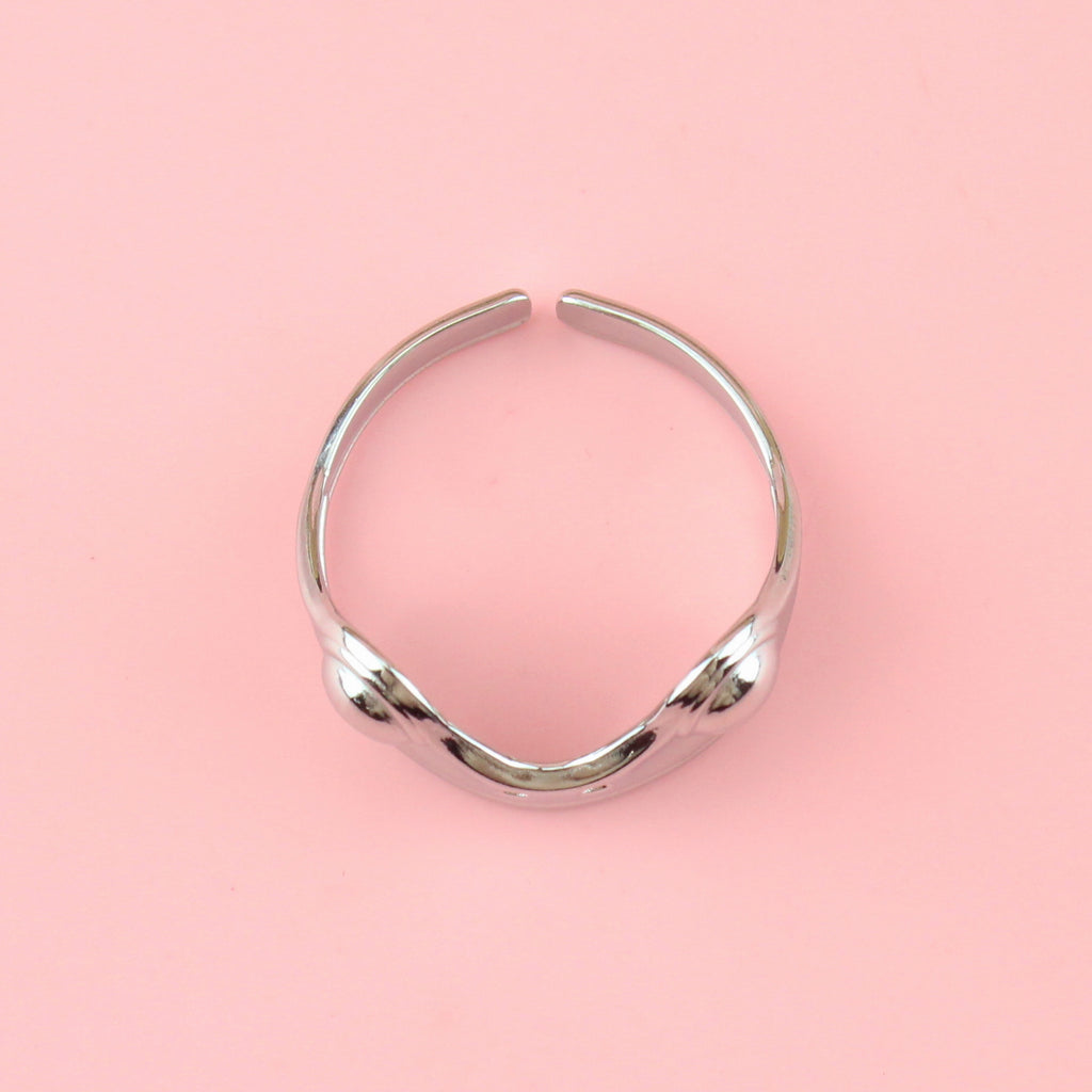 stainless steel ring featuring two frog eyes and nostrils on the front of the ring