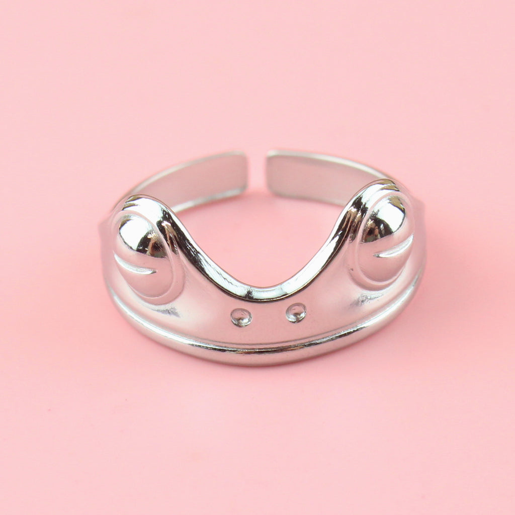 stainless steel ring featuring two frog eyes and nostrils on the front of the ring