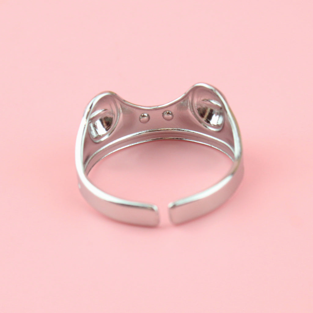 stainless steel ring featuring two frog eyes and nostrils on the front of the ring