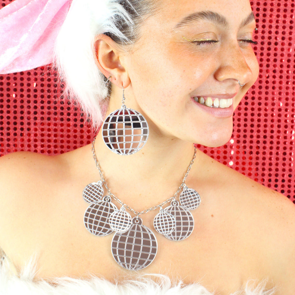 Model wearing Large Disco Ball earrings with a matching necklace