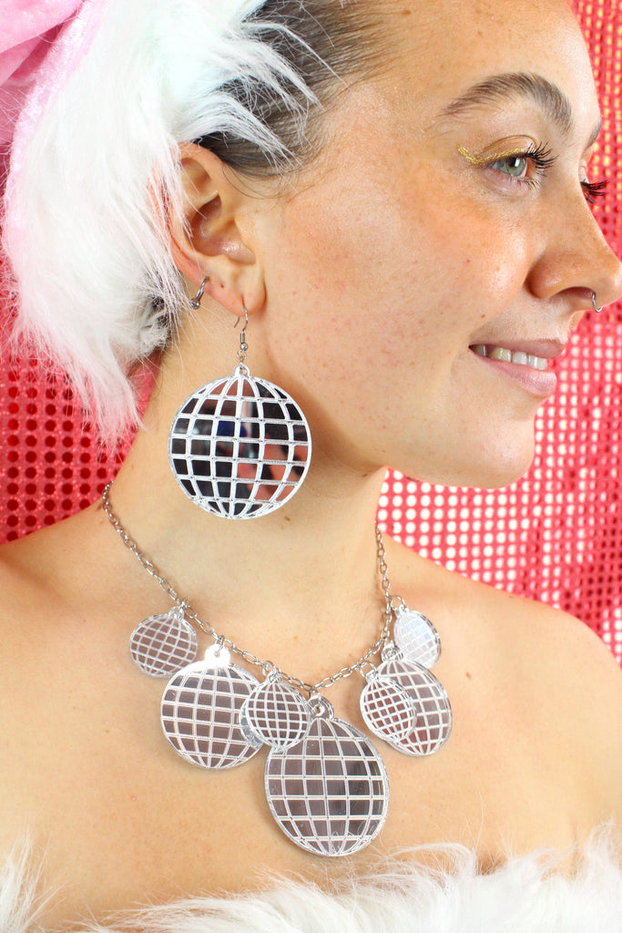 Model wearing Large Disco Ball earrings with a matching necklace