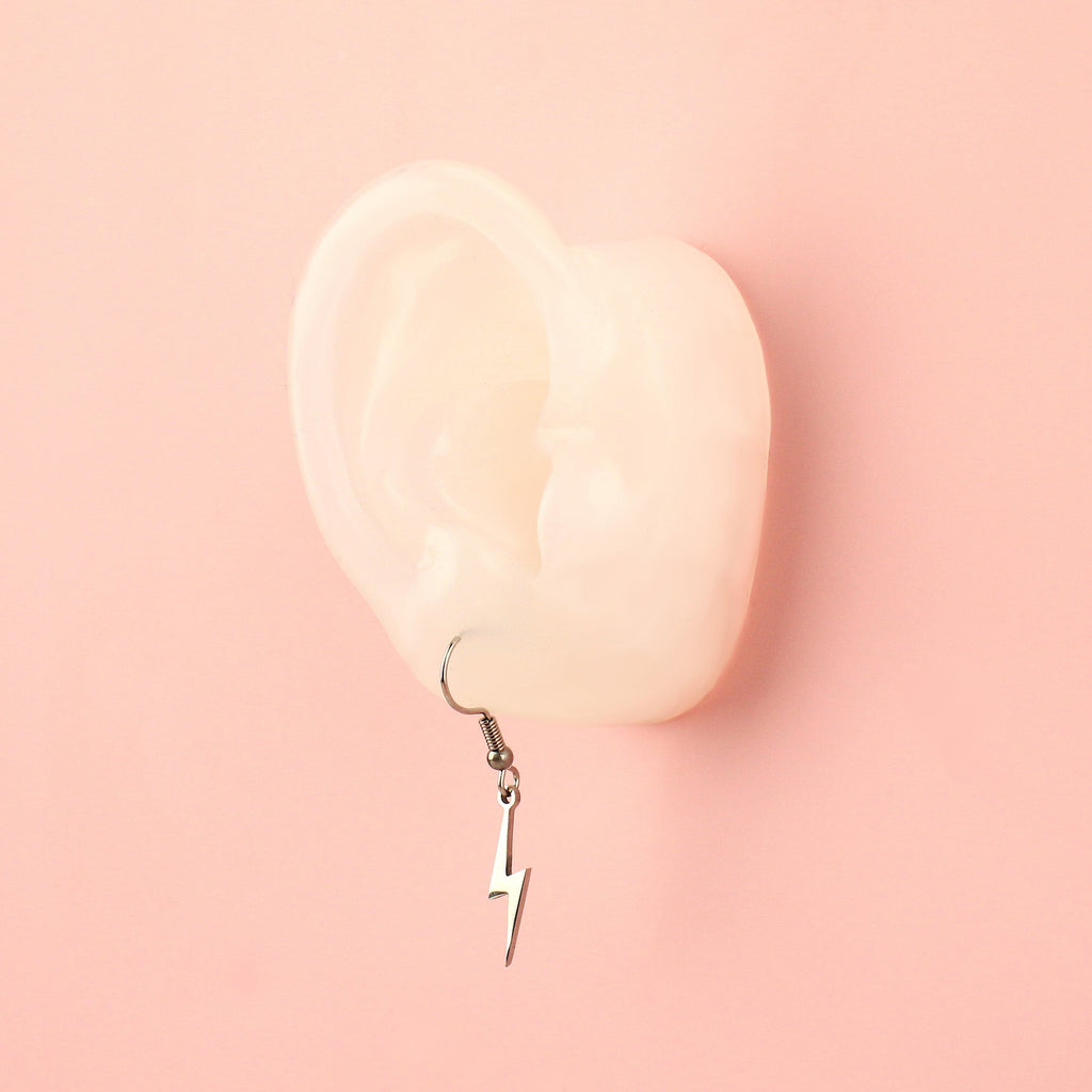 Ear wearing Lightning Bolt Earrings